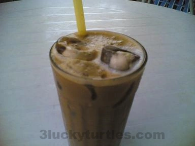Image for post A glass of iced milk coffee and tea brew drink that is popular in Hong Kong.