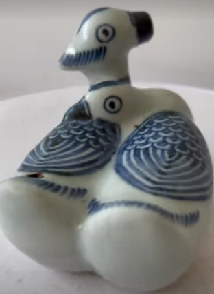 Image for post Porcelain-made mandarin ducks figurine.